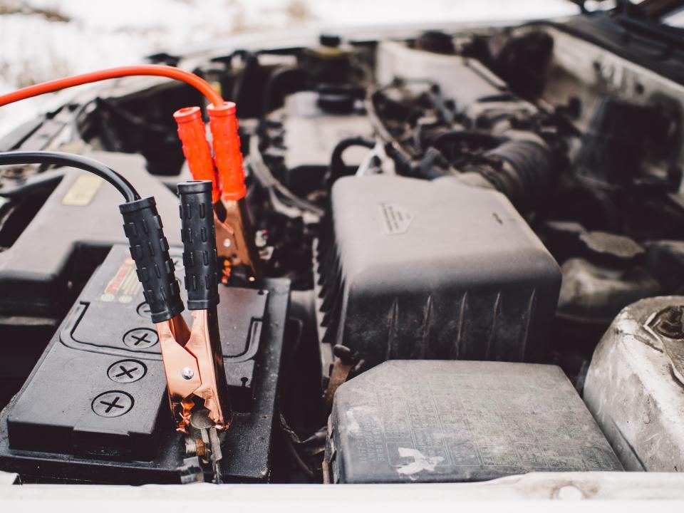 Jumper cables on a car battery
